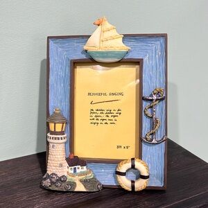 Vintage nautical photo frame with lighthouse anchor and boat. 6.5 x 5.5